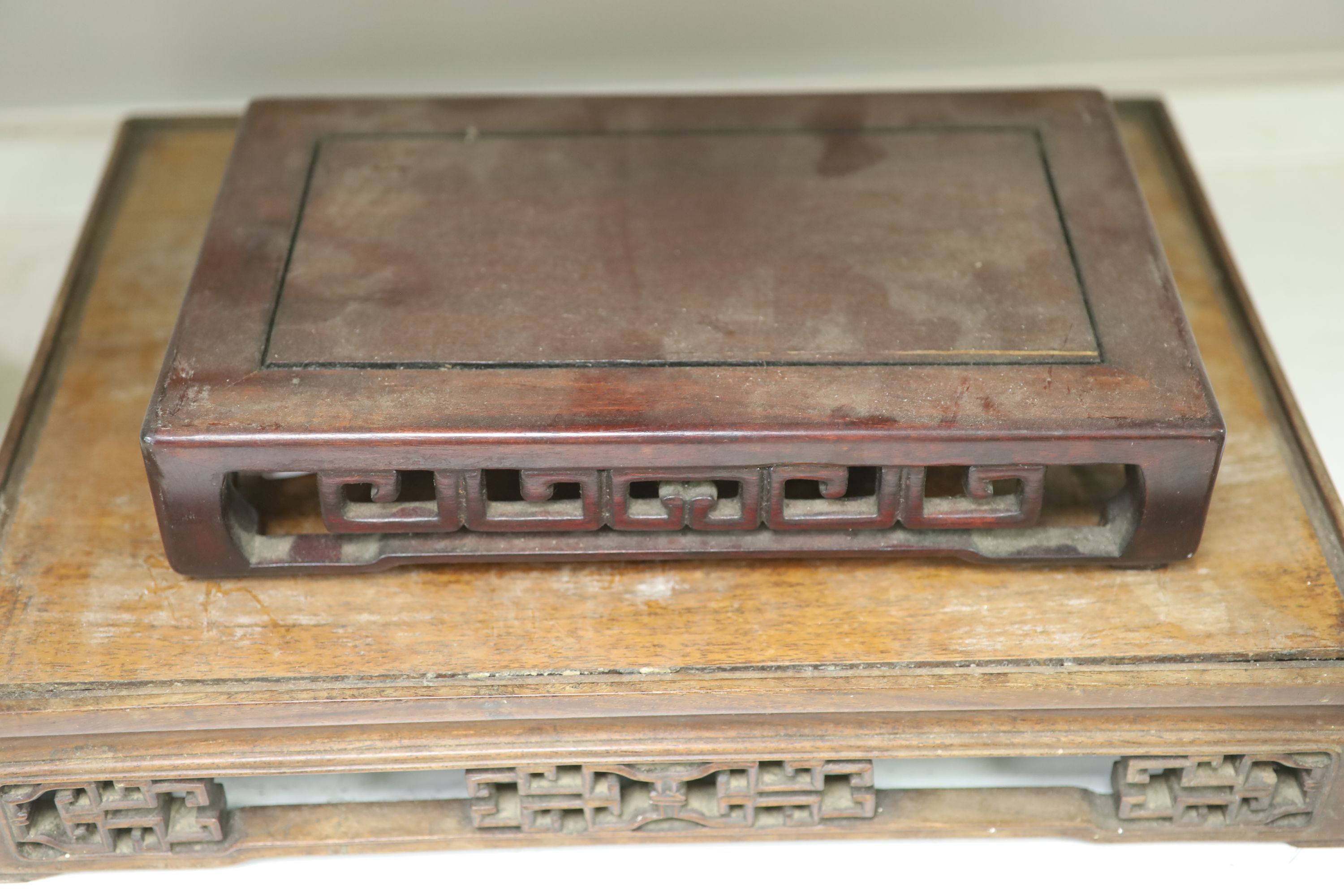 Three Chinese hardwood stands, 19th/20th century, largest 42.5 x 32cm